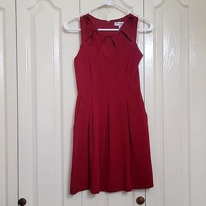 Red cutout fit and flare dress with pockets